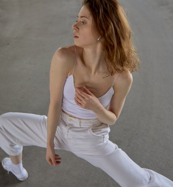 Woman in an elegant yoga pose symbolizing morning energy and flow.